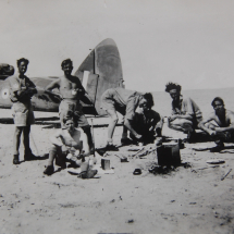 Ron Chapman, pilot, makes tea for fellow airmen on Djinna Island, off coast of Saudi Arabia April 1943 with downed Bisley aircraft. Ron Chapman was with with RAF Communications Flight, Habbaniya, flying out of Bahrein for the recovery mission.