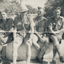 BAHREIN: On the road by virgin pool. Ron Chapman is 2nd from left. Probably taken around April, 1943 when he was in Bahrein, between flights to Djinna Island rescuing a Bisley aircraft.