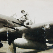 Ron Chapman climbing into the cockpit of a Hurricane Mk IIc. Note the long distance fuel tanks under the wings. photograph probably taken at Takoradi, Ghana early 1942.