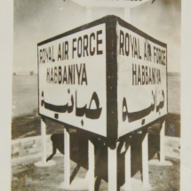 Postcard of RAF Habbinaya sign, outside Baghdad, Iraq.